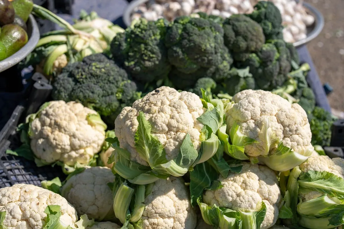 Cauliflower and broccoli for sale at a market