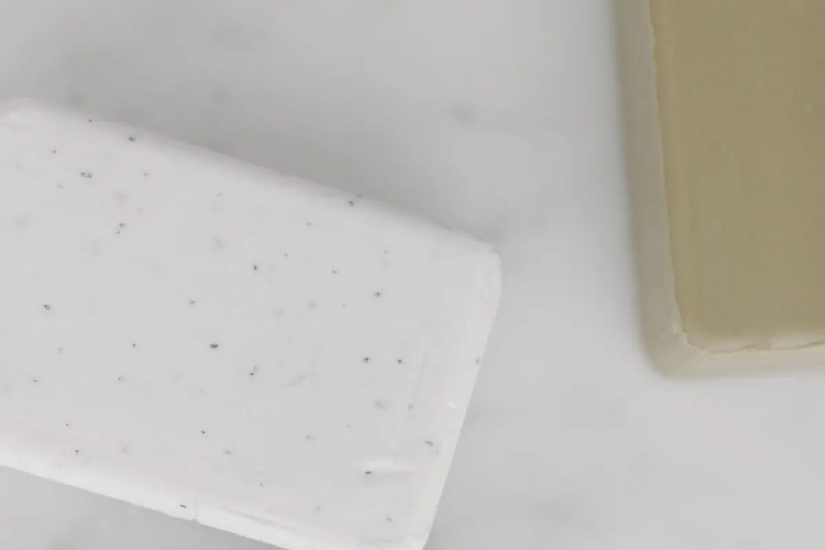 White bath soap bar on a stone surface
