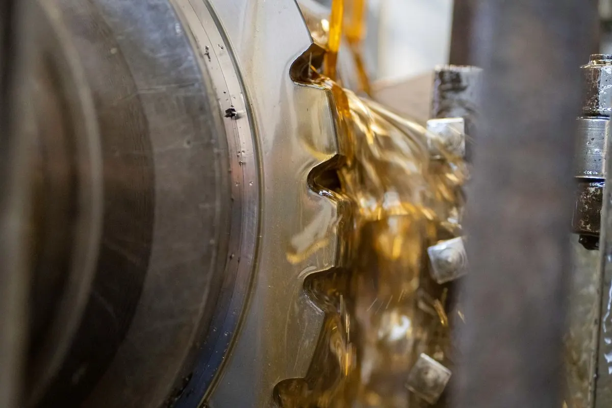 Lubricating oil coating the gears of an industrial machine