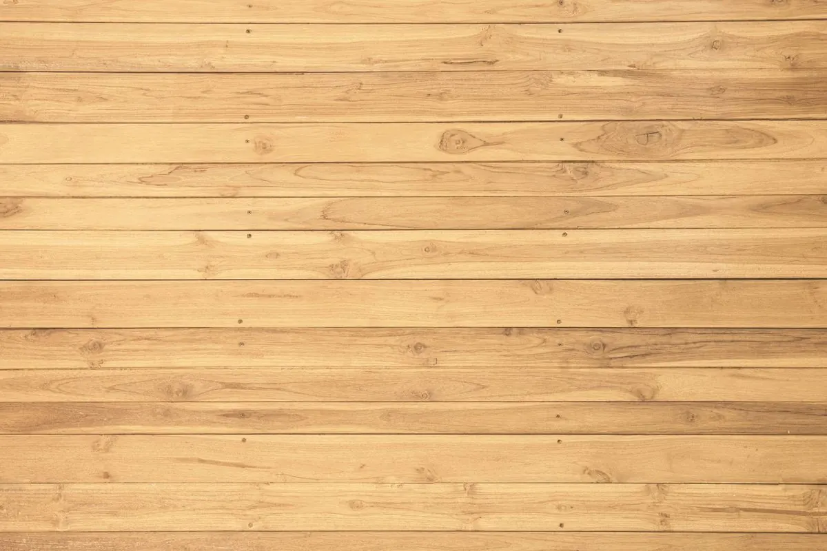 Light yellow wooden floor planks laid horizontally