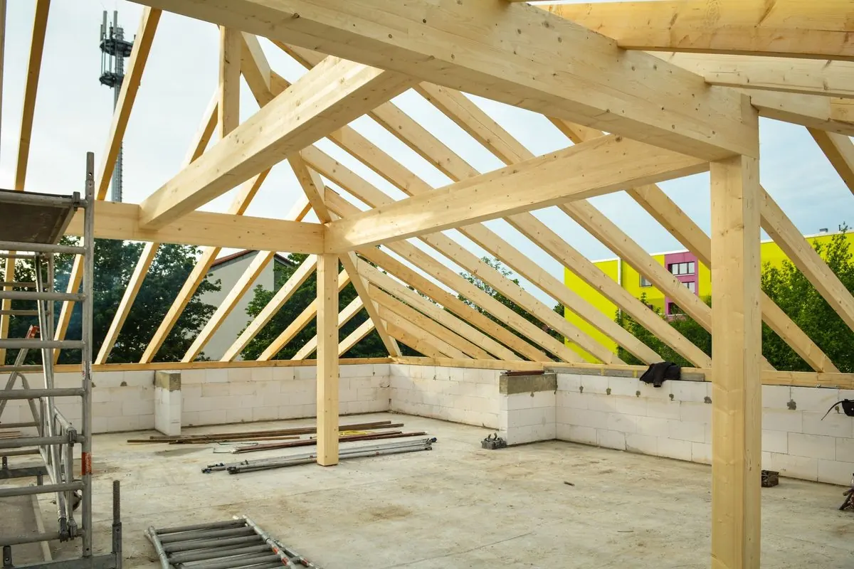 Light timber roof frame of beams on a building under construction