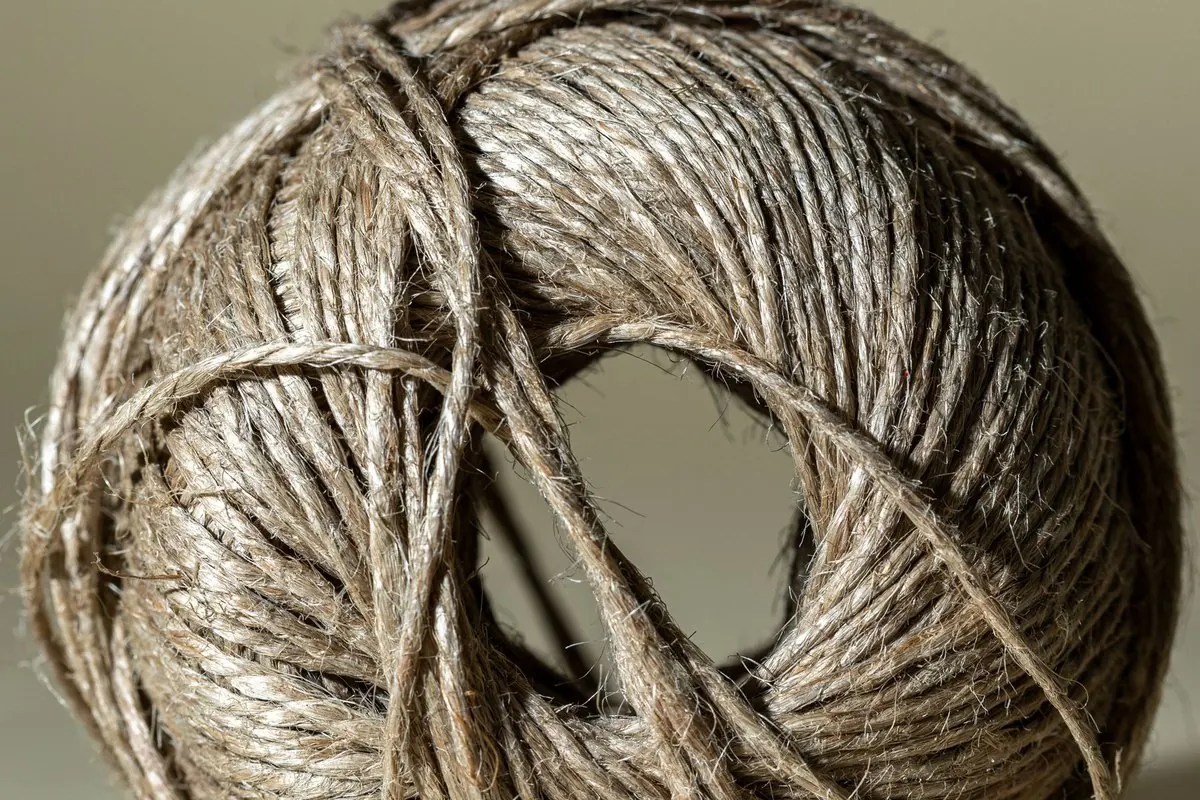 Ball of twisted jute twine in greyish brown, close-up