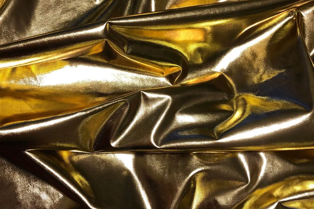 Close-up of crumpled metallic gold fabric