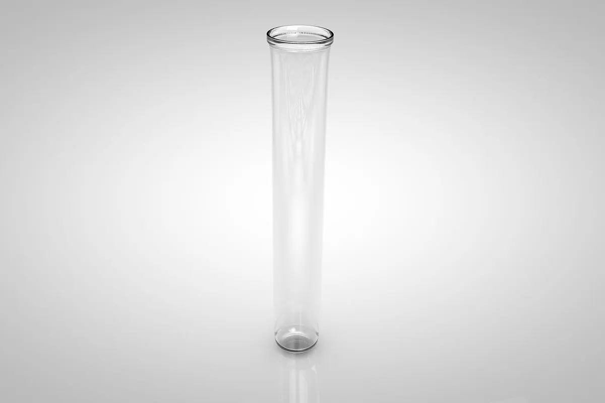 A single long clear glass tube standing on a grey background