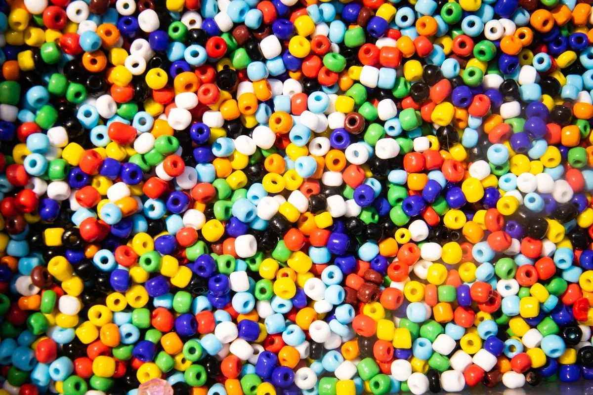 Many multicolored glass seed beads filling the frame
