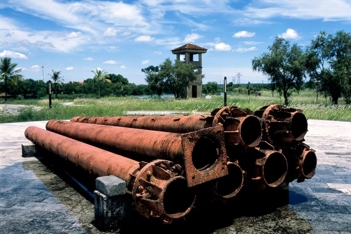 Stack of rusty steel pipes outdoors