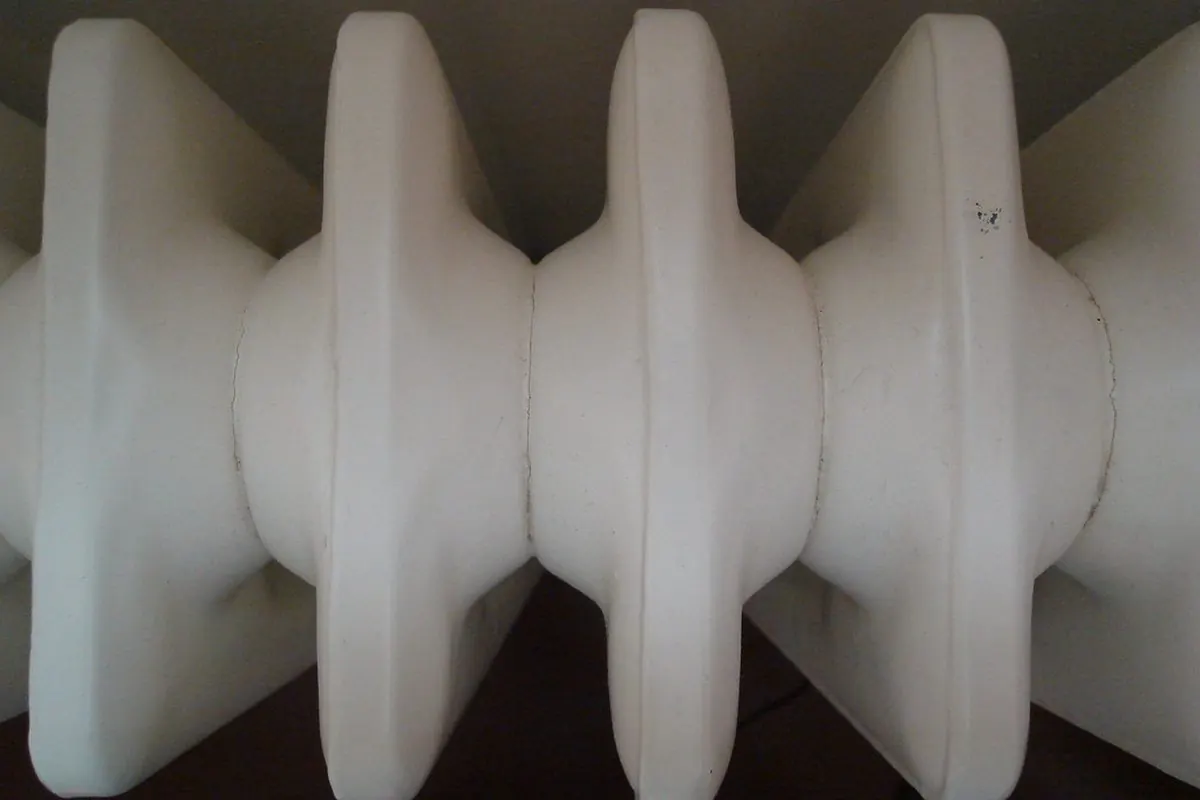 Close-up of a white multi-section heating radiator