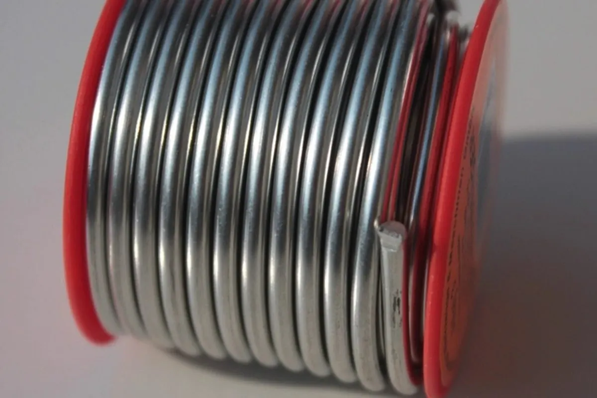 Spool of silver solder wire on a red reel