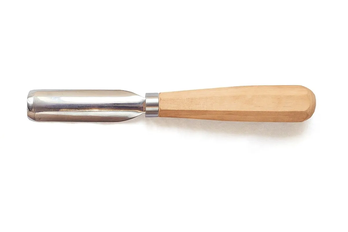 Wood chisel with a light wooden handle on a white background