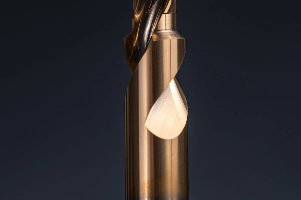 Close-up of a metal drill bit on a dark background