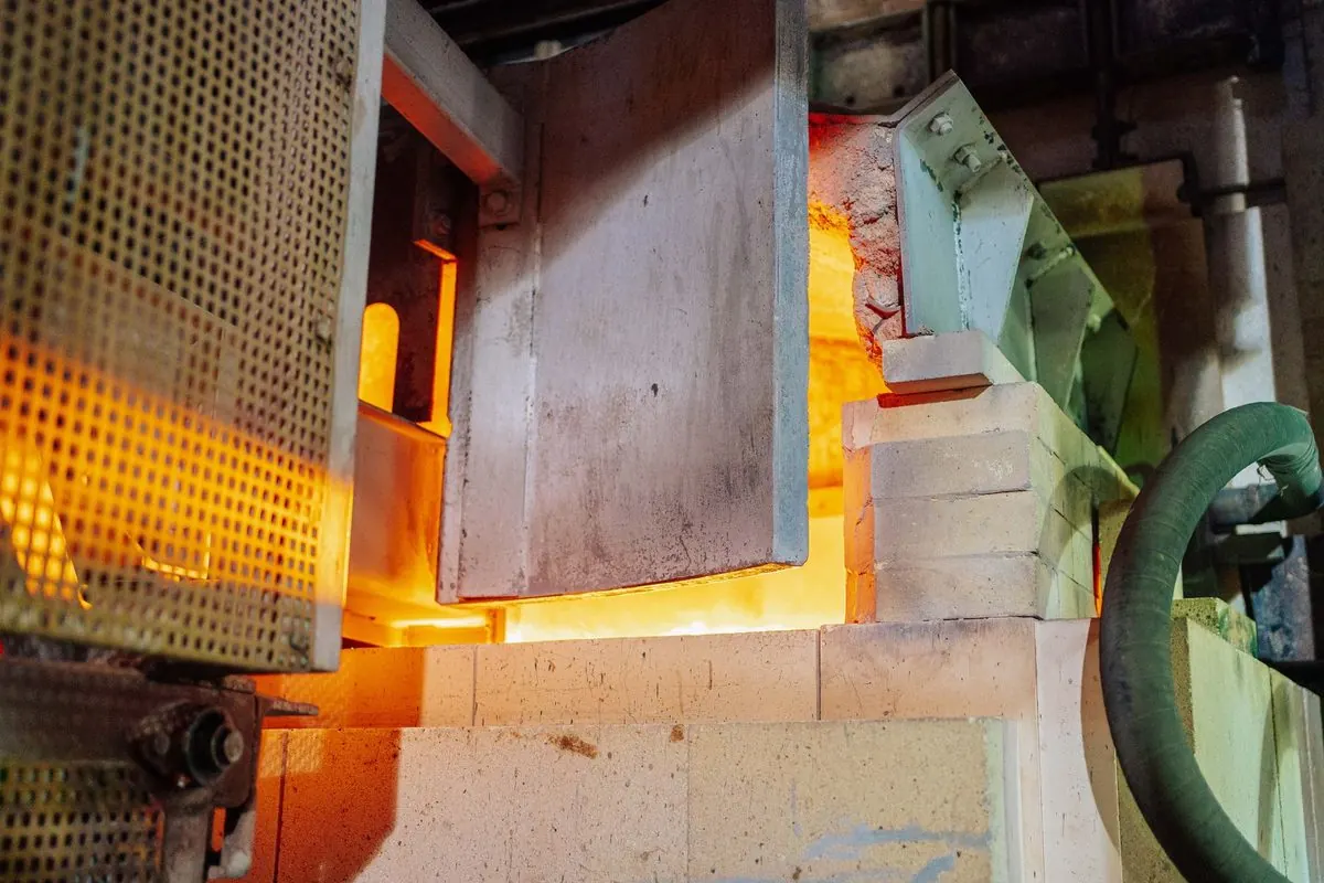 Open door of a glowing industrial furnace