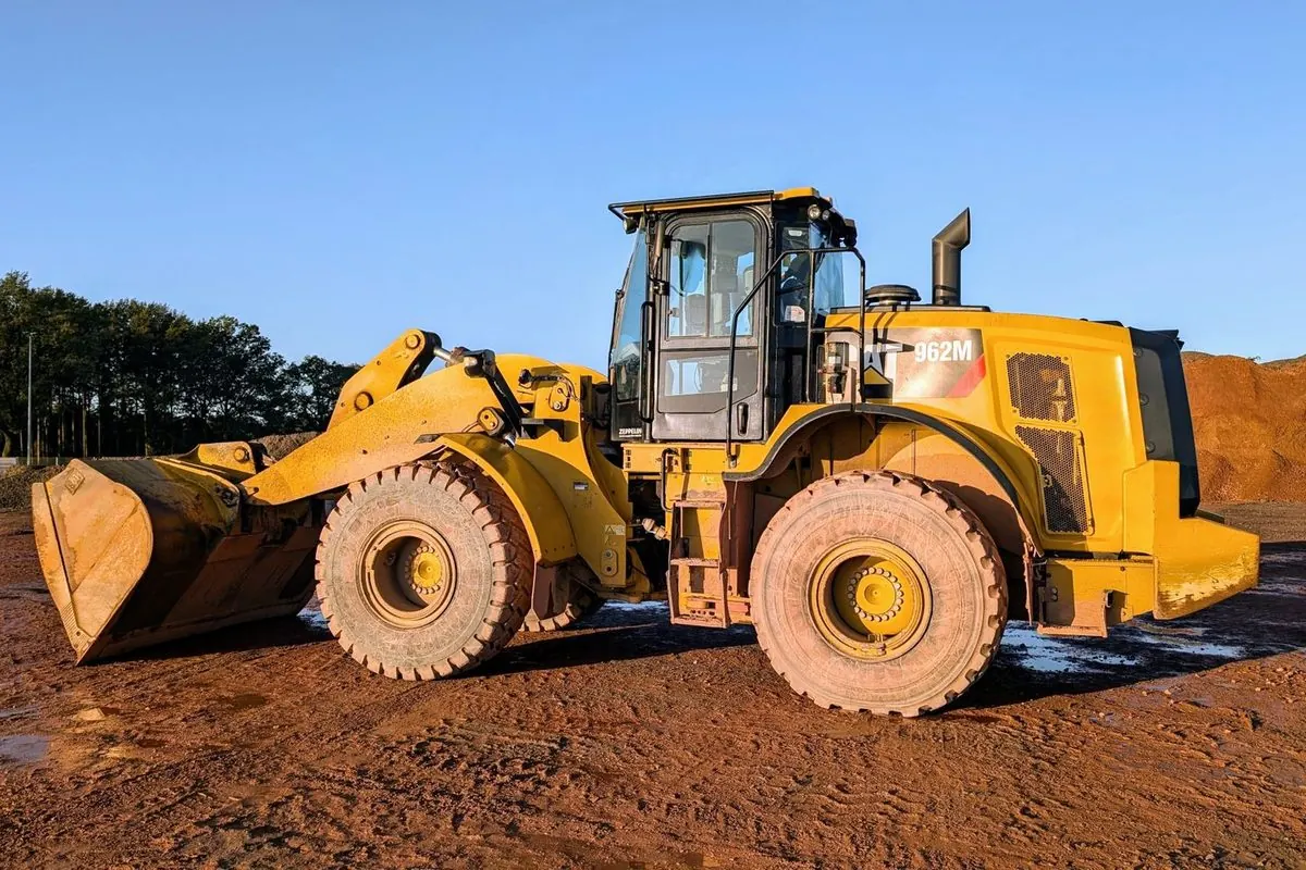 Yellow wheel loader with front bucket