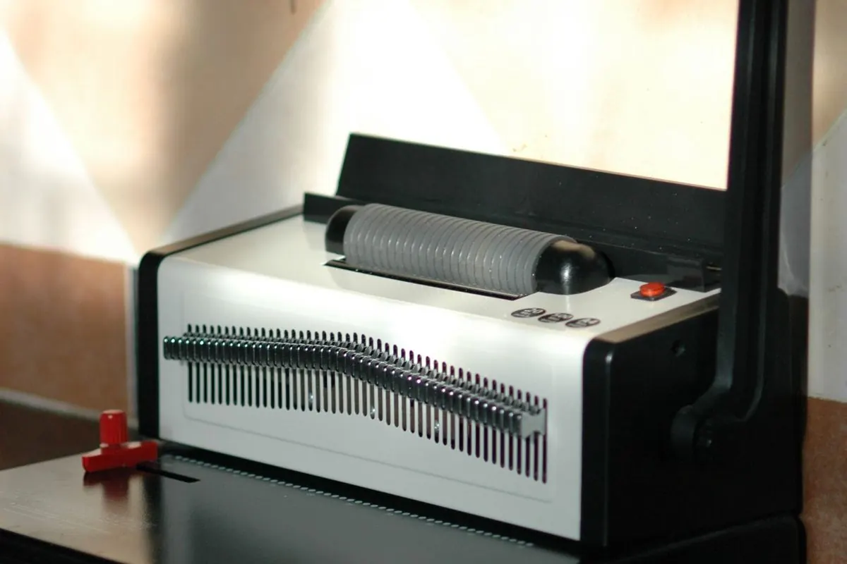 Comb binding machine on a table