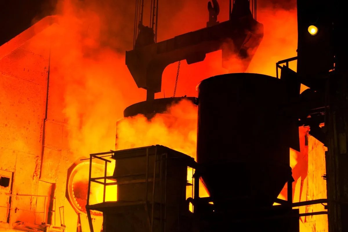 Steel converter vessel in a steel mill with glowing fire