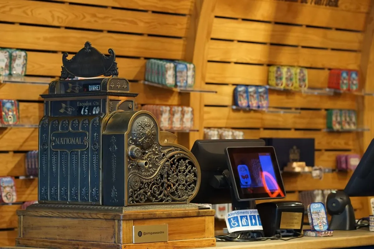 Vintage brass cash register on a shop counter