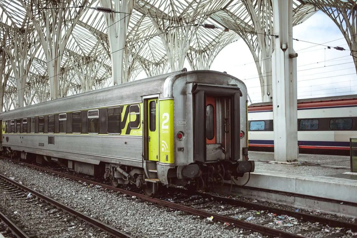 Grey passenger coach in a railway station