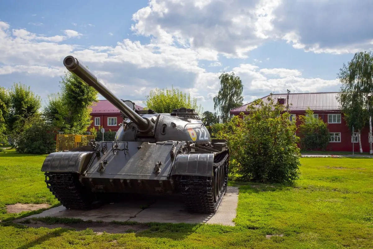 Grey battle tank on a grass lawn