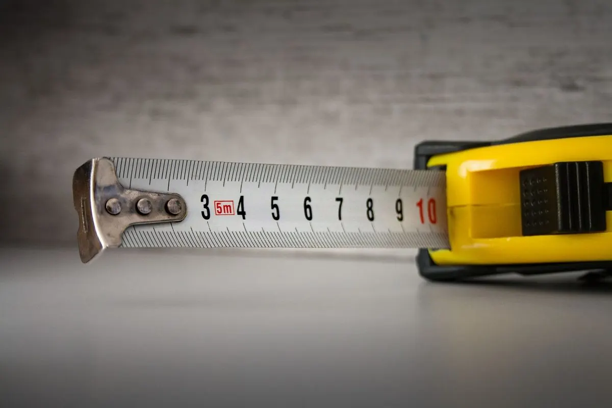 Yellow tape measure extended to the 10 cm mark