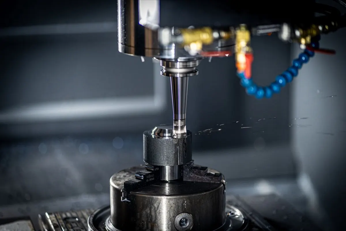 CNC cutting tool machining a metal part